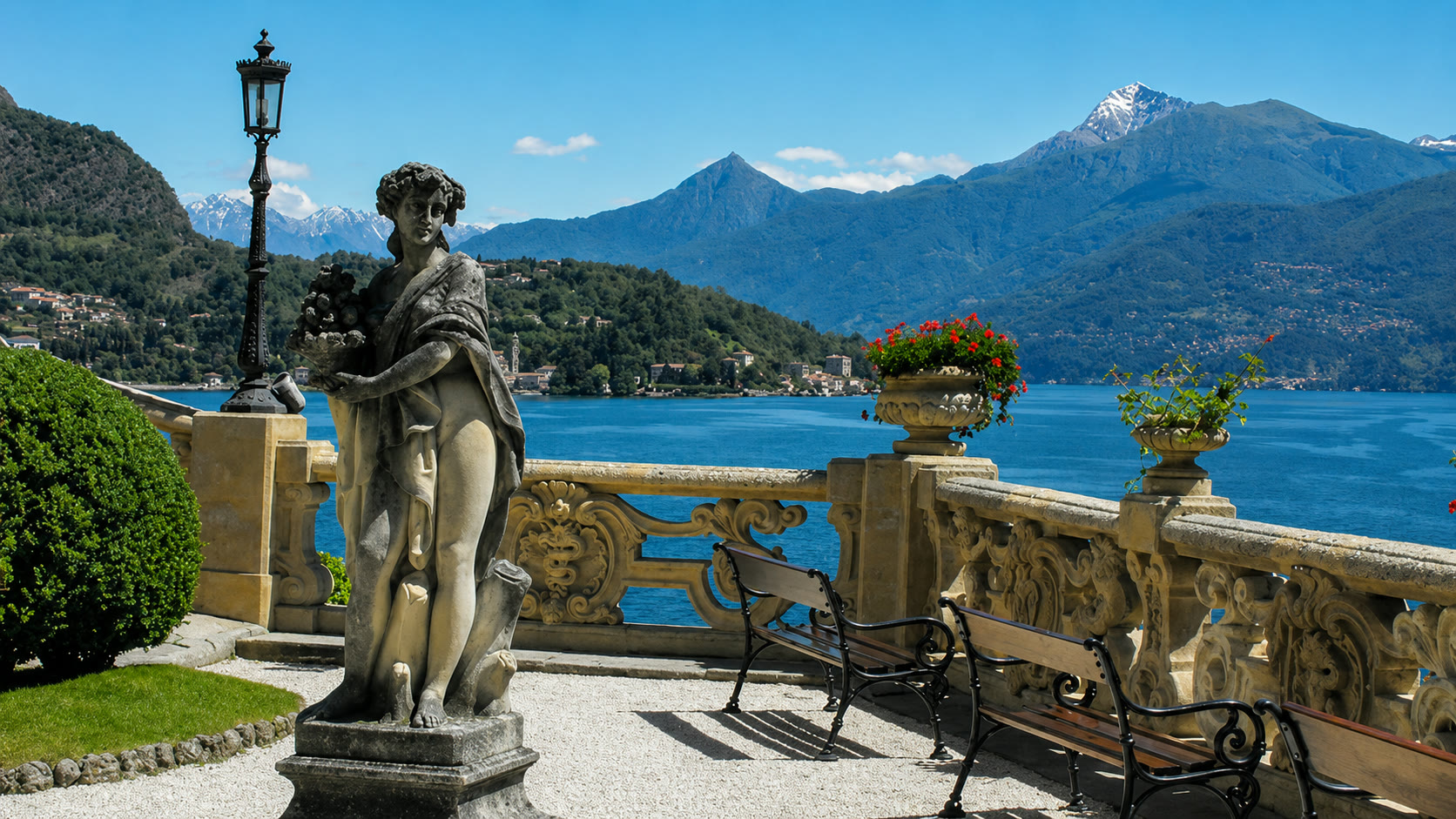 Terrace with a statue overlooking Lake Como